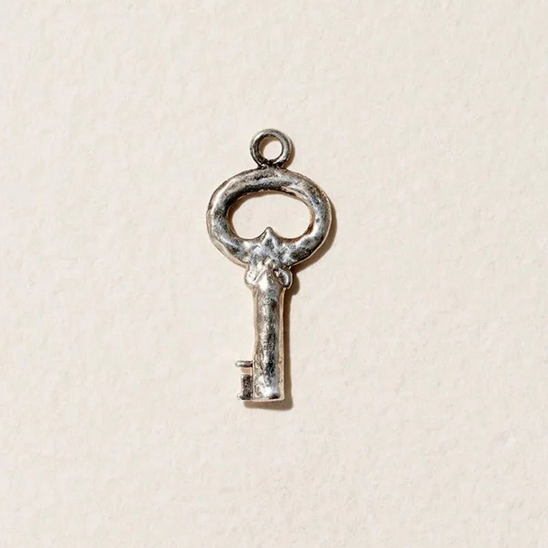 Fini’s Key Charm by Pamela Love – Charm in #product_material# (#product_color#).  fini-s-key-charm-sterling-silver