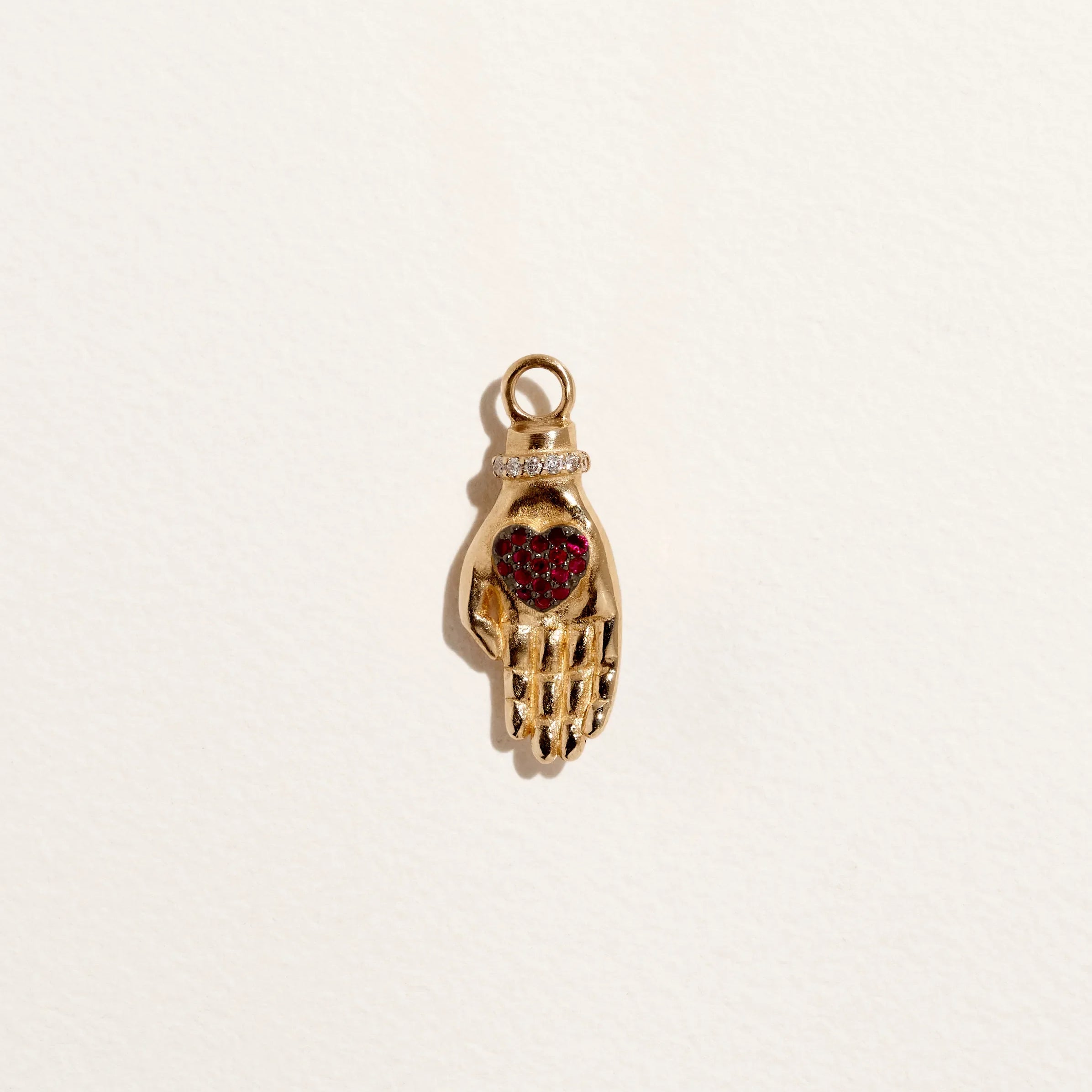 Heart in Hand Charm by Pamela Love – Charm in #product_material# (#product_color#).  heart-in-hand-charm-gold-ruby-red