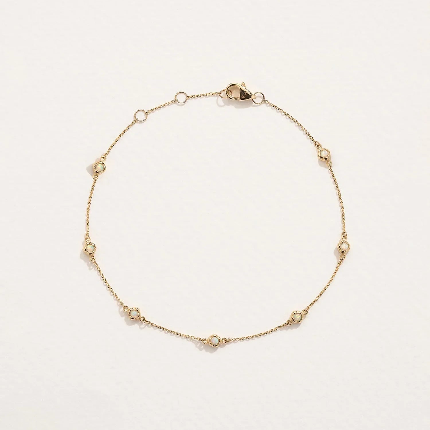 Molten Anklet by Pamela Love – Anklets in #product_material# (#product_color#).  molten-bezel-station-anklet-gold-opal-white